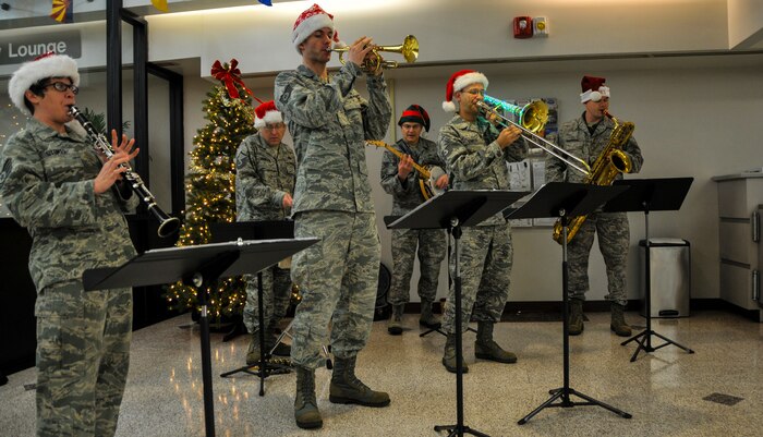 The United States Air Force Heritage Ramblers Dixieland Ensemble from Joint Base Langley – Eustis, Va., play holiday music Dec. 13, 2012, at JB Charleston – Air Base, S.C. Six members from the USAF Heritage Ramblers performed holiday carols at several commands on the Air Base and Weapons Station. The USAF Heritage Ramblers, a part of the Heritage of America Band, was formed in 2010. The group's mission is to preserve and present the rich heritage of traditional jazz. With the music of such legends as Louis Armstrong, Sidney Bechet, Jack Teagarden, and Bix Beiderbecke as their guide, Heritage Ramblers bring the New Orleans and Chicago styles of traditional jazz to life in each performance. (U.S. Air Force photo/ Airman 1st Class Jared Trimarchi)