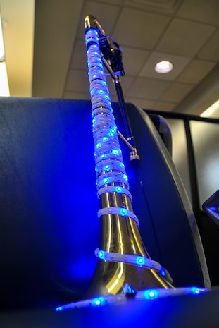 Tech. Sgt. John Garcia’s trombone is lit up and ready to play Dec. 13, 2012, at the passenger terminal on Joint Base Charleston – Air Base , S.C. Six members from the USAF Heritage Ramblers from Joint Base Langley – Eustis, Va., performed holiday carols at several commands on the Air Base and Weapons Station. The USAF Heritage Ramblers, a part of the Heritage of America Band, was formed in 2010. The group's mission is to preserve and present the rich heritage of traditional jazz. With the music of such legends as Louis Armstrong, Sidney Bechet, Jack Teagarden, and Bix Beiderbecke as their guide, Heritage Ramblers bring the New Orleans and Chicago styles of traditional jazz to life in each performance.  (U.S. Air Force photo/ Airman 1st Class Jared Trimarchi)