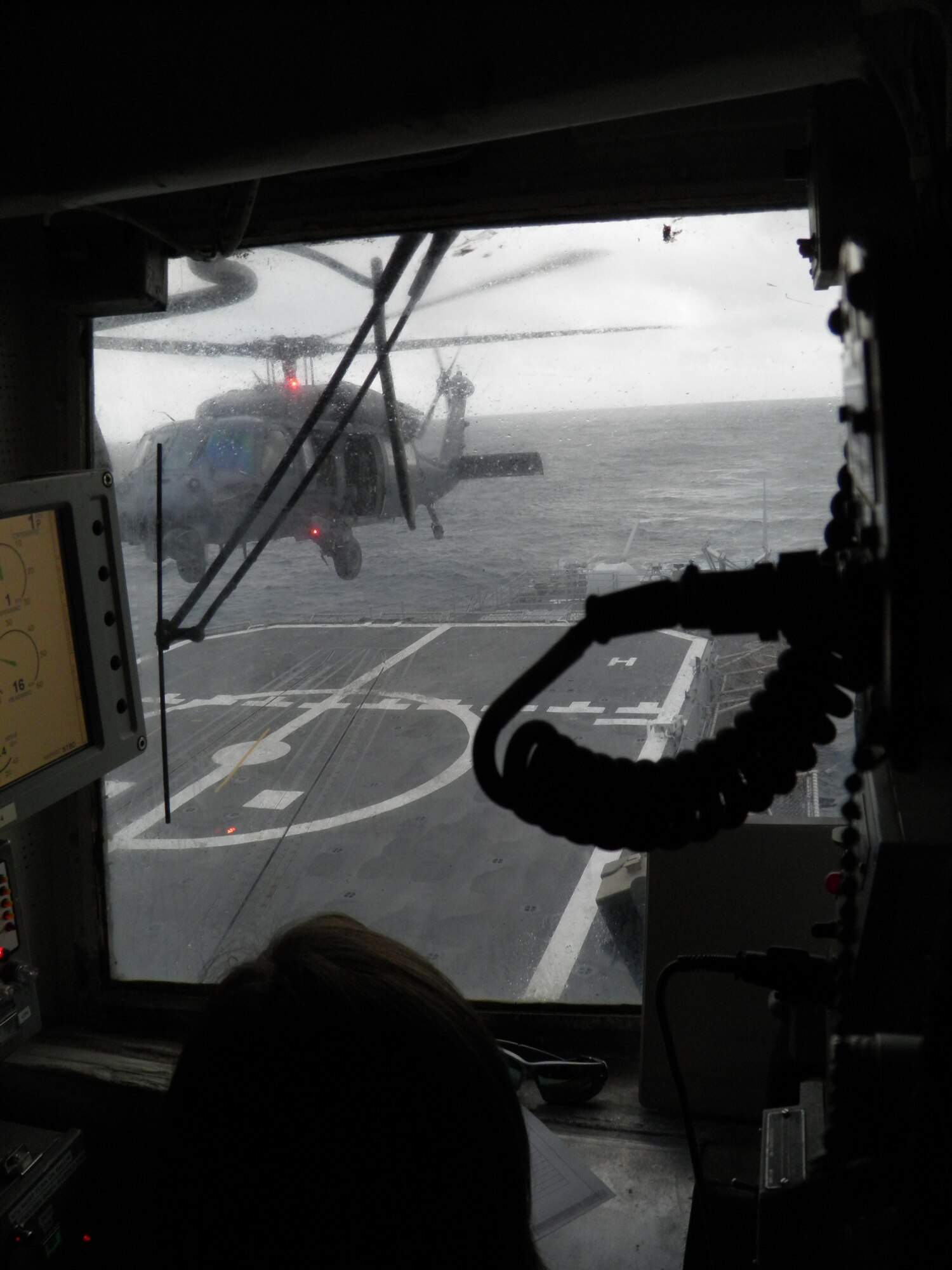 920th Rescue Wing, Patrick Air Force Base, Fla., aircrew conduct shipboard operations with an HH-60G Pave Hawk helicopter 60 miles off the coast of Mayport, Fla., Friday, Dec. 7, 2012. The USS Philippine Sea CG-58 landings qualified the aircrew to land onboard single-spot ships. (Courtesy photo) 