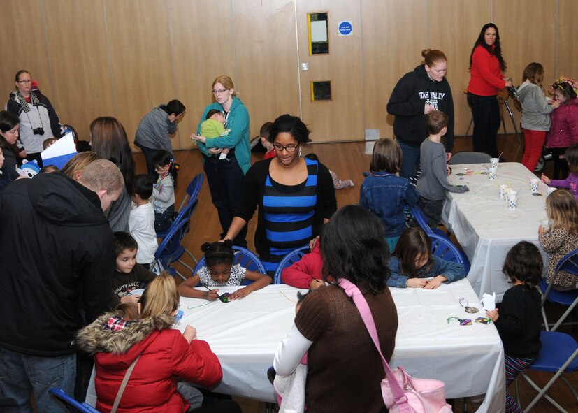 Team Mildenhall families come together for the Winter Arts and Crafts party Dec. 18, 2012, at the Bob Hope Community Center at RAF Mildenhall, England. Hosted by the community center, the event gave families the chance to make some holiday-themed ornaments and crafts. (U.S. Air Force photo by Airman 1st Class Kelsey Waters/Released)