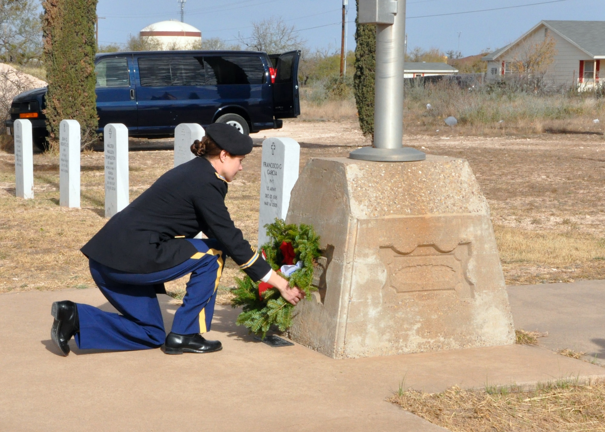 SAN ANGELO, Texas – Army Lt. Col. Devon Blake, Army 344th Military Intelligence Battalion Commander, places a wreath at the base of the flagpole in the Belvedere Cemetery Dec. 15. Blake was the first military member of the day to place a wreath at the base of the flagpole. (U.S. Air Force photo/ 1st Lt. Leanne Hedgepeth)
