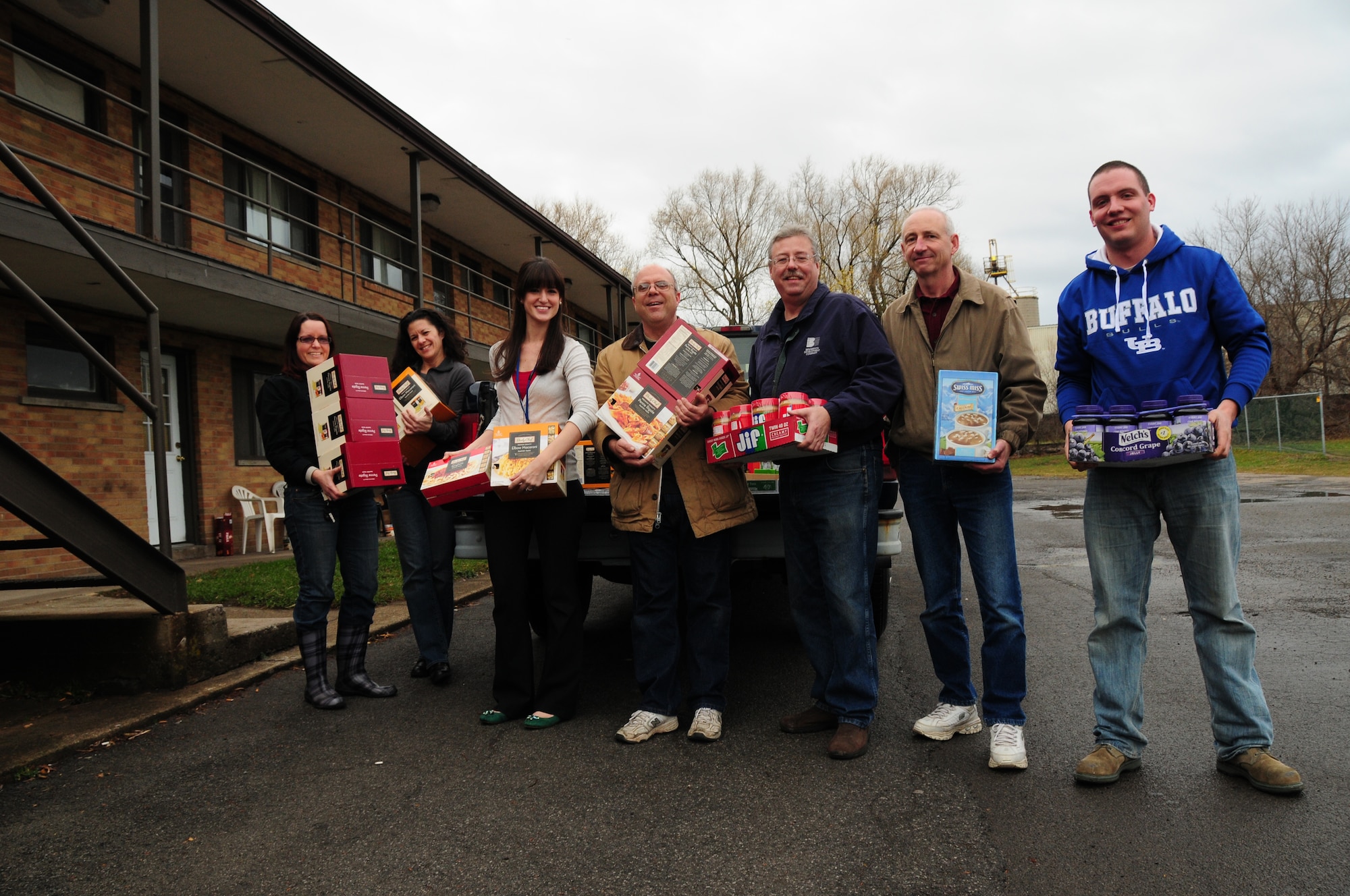 107th Airlift Wing airmen deliver truck load of food goods to the Niagara Falls Community Mission. Staff Sgt. Jeanette Valdez, Chief Master Sgt. Virginia Ballester, Andrea Gray, Tech. Sgt. Paul Wiegand, Master Sgt. Mark Lewandowski, Master Sgt. Steven Buja and  Staff Sgt, Robert Kurzdorfer on December 18, 2012 (Air National Guard  Photo/Senior Master Sgt Ray Lloyd)

