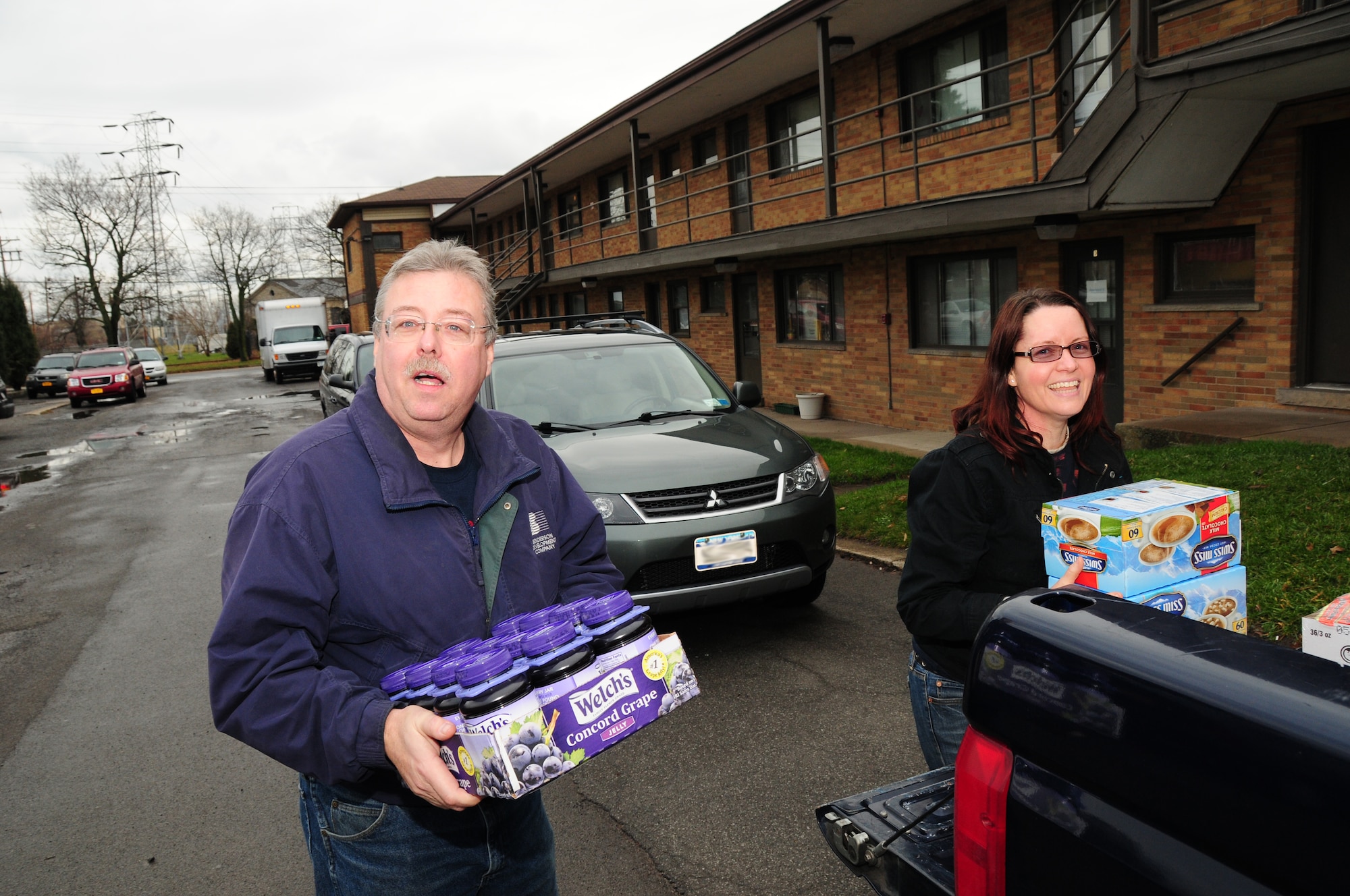 107th Airlift Wing airmen deliver truck load of food goods to the Niagara Falls Community Mission.  Master Sgt. Mark Lewandowski and Staff Sgt. Jeanette Valdez helping on the delivery on December 18, 2012 (Air National Guard Photo/Senior Master Sgt Ray Lloyd)