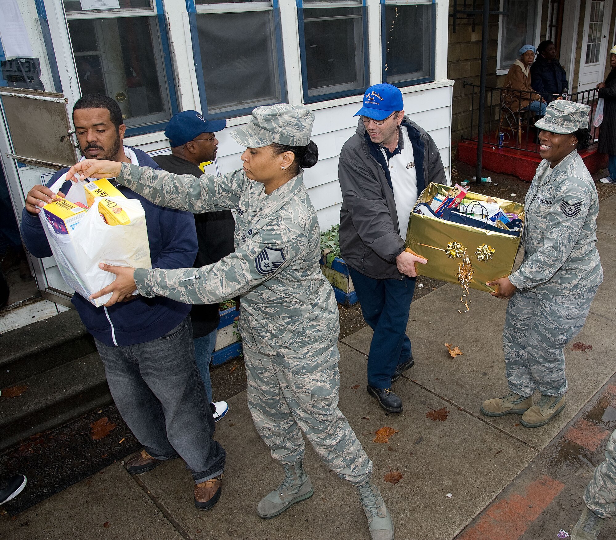 MSgt. Khadija Ross and TSgt. Aisha Toston of the 436th Medical Group at Dover Air Force Base, Del. deliver donated food and clothing items to the Operation Pride homeless shelter on Dec. 10, 2012. (U.S. Air Force photo by Greg L. Davis)
