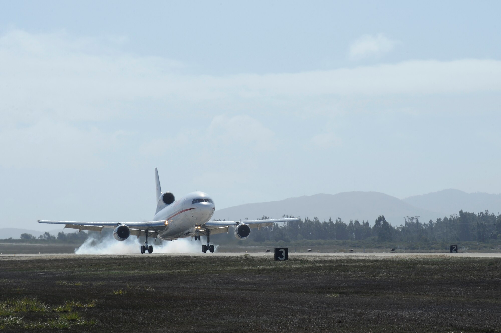 VANDENBERG AIR FORCE BASE, Calif. -- Orbital Science's L-1011 aircraft arrives on the flight line here Tuesday, March 6, 2012. The aircraft will carry a Pegasus rocket that will launch NASA's NuStar satellite into orbit. (U.S. Air Force photo/Staff Sgt. Andrew Satran) 