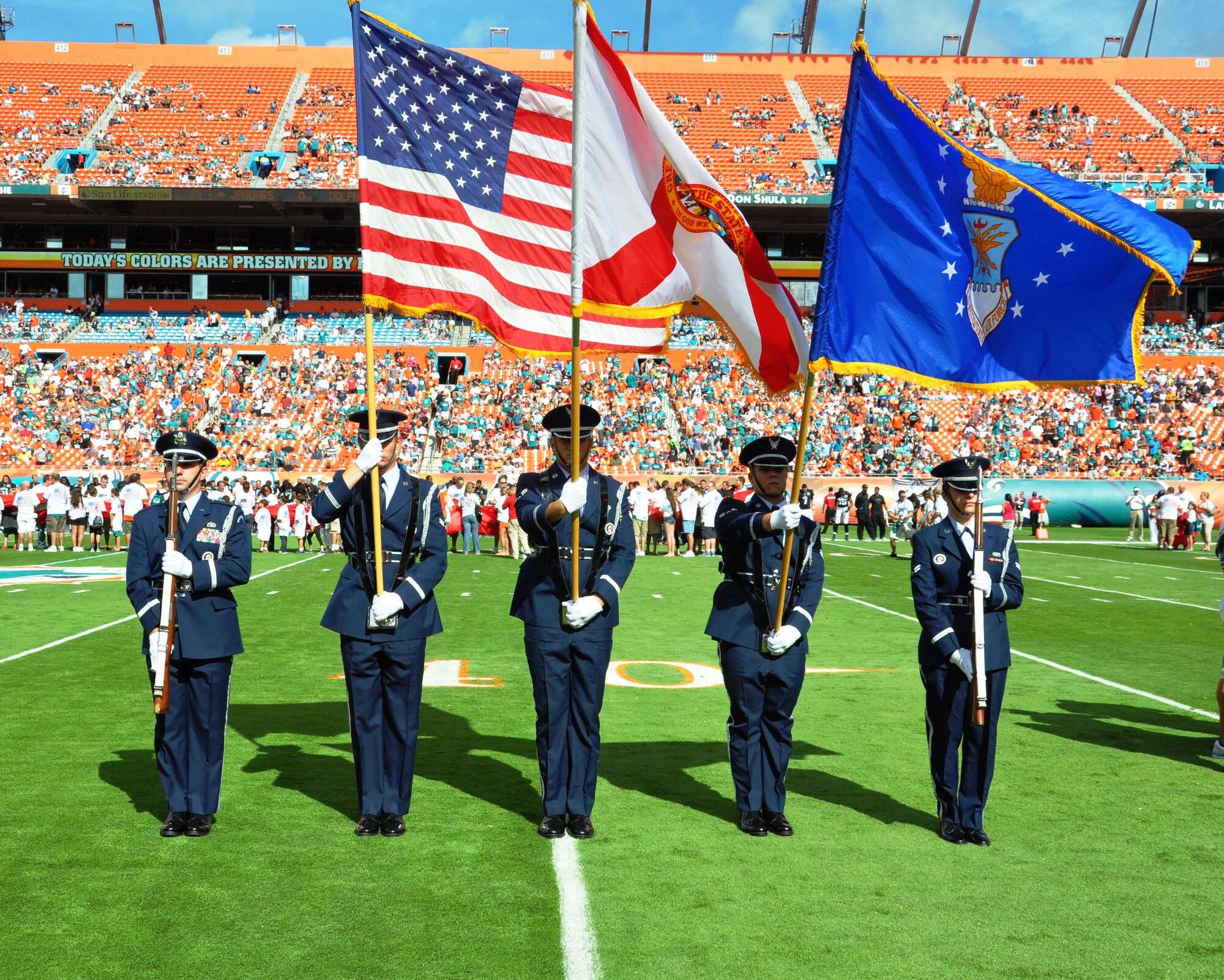 The 45th Space Wing Honor Guard (left to right) 2nd Lt. Steven Braddick,
Airman 1st Class Gregg Helms, Airman 1st Class Chris Sigler, Airman 1st
Class Phil Bridges and Airman 1st Class Katie Holcomb, provided the colors
for the game between the Miami Dolphins and the Jacksonville Jaguars at Sun
Life Stadium Dec. 16, 2012.

(Photo by 2nd Lt. Alicia Wallace)