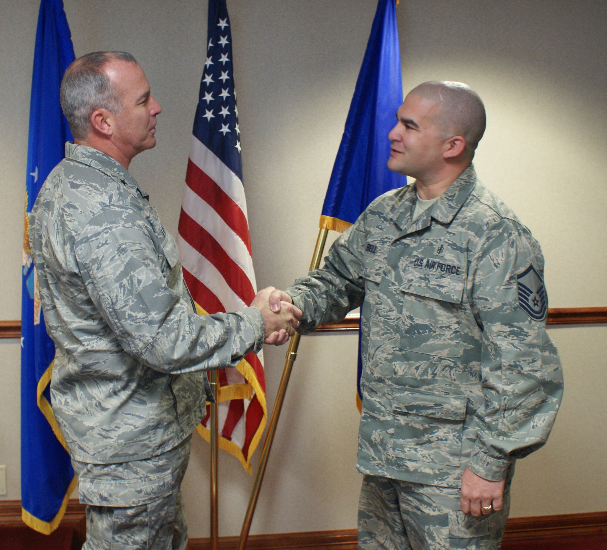 Brig. Gen. Michael Fantini (left), 82nd Training Wing commander, congratulates Master Sgt. Jason Bell, 82nd Medical Support Squadron, for being named "Commander's Wingman of Choice" for Dec. 17-21.  Bell was recognized during the 82nd TRW staff meeting Dec. 19, 2012. (U.S. Air Force photo/Dan Hawkins)