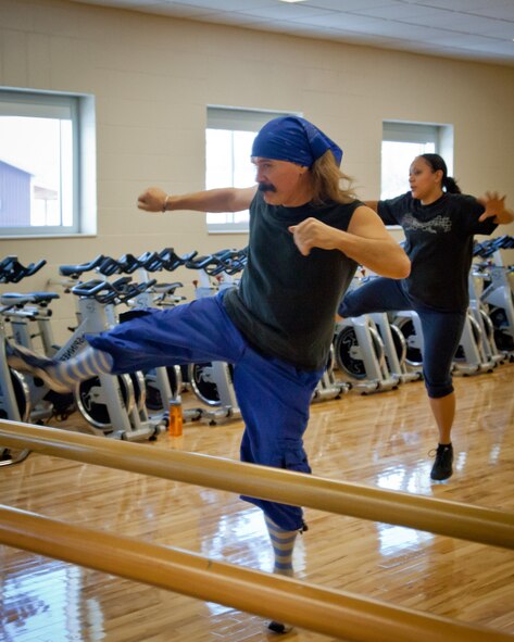 Jimmy Parker leads a Zumba® class at the fitness center at the Minneapolis-St. Paul Air Reserve Station, Minn.  Several fitness classes, including spinning, yoga, and cardio sculping are available free of charge to indviduals with a vaild Department of Defense ID card and their guests.  (U.S. Air Force Photo/Shannon McKay)
