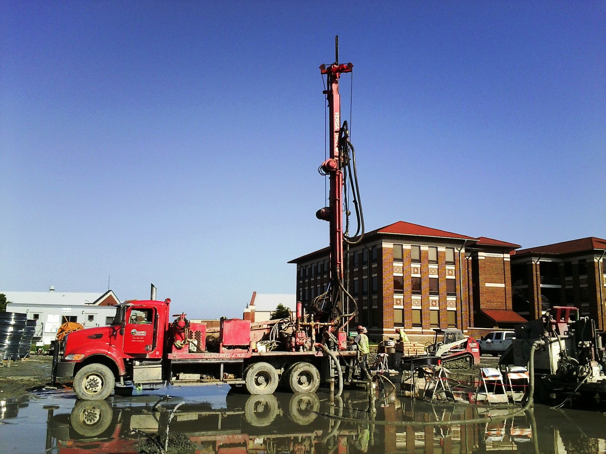 Construction workers bury pipes 400 feet beneath parking lots on the Air Combat Command campus, Langley Air Force Base, VA. ACC personnel can expect diminished parking availability until the construction project is complete. (U.S. Air Force courtesy photo/Released)