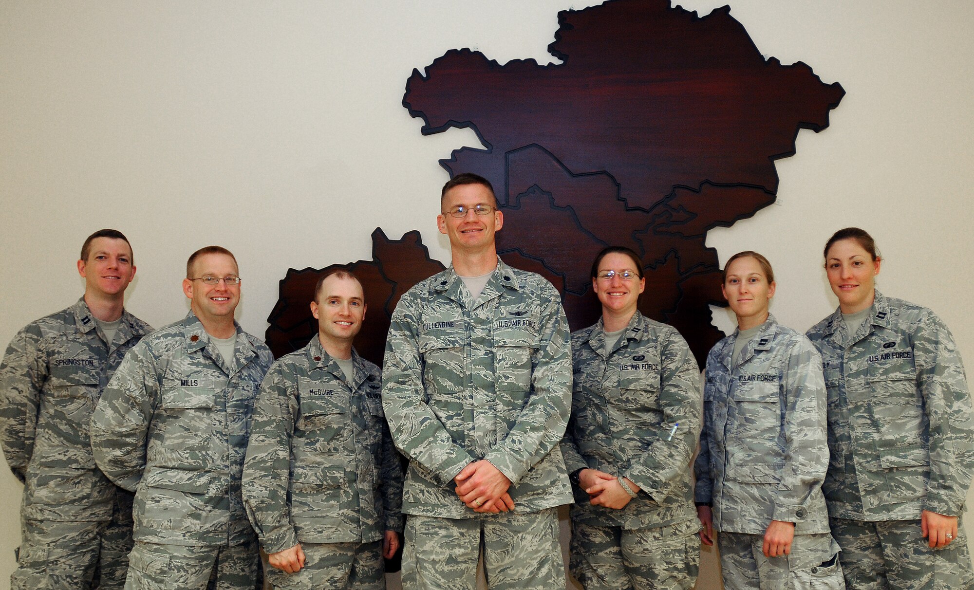 Airmen from the Combined Air and Space Operations Center’s Operational Assessment Team pose for a group photo at a deployed location in Southwest Asia, Nov. 26. OAT provides information and analysis on everything from weapons systems to surveillance and reconnaissance efforts in support of the CAOC’s strategy division. (US Air Force photo/Staff Sgt. Ashley Reed)