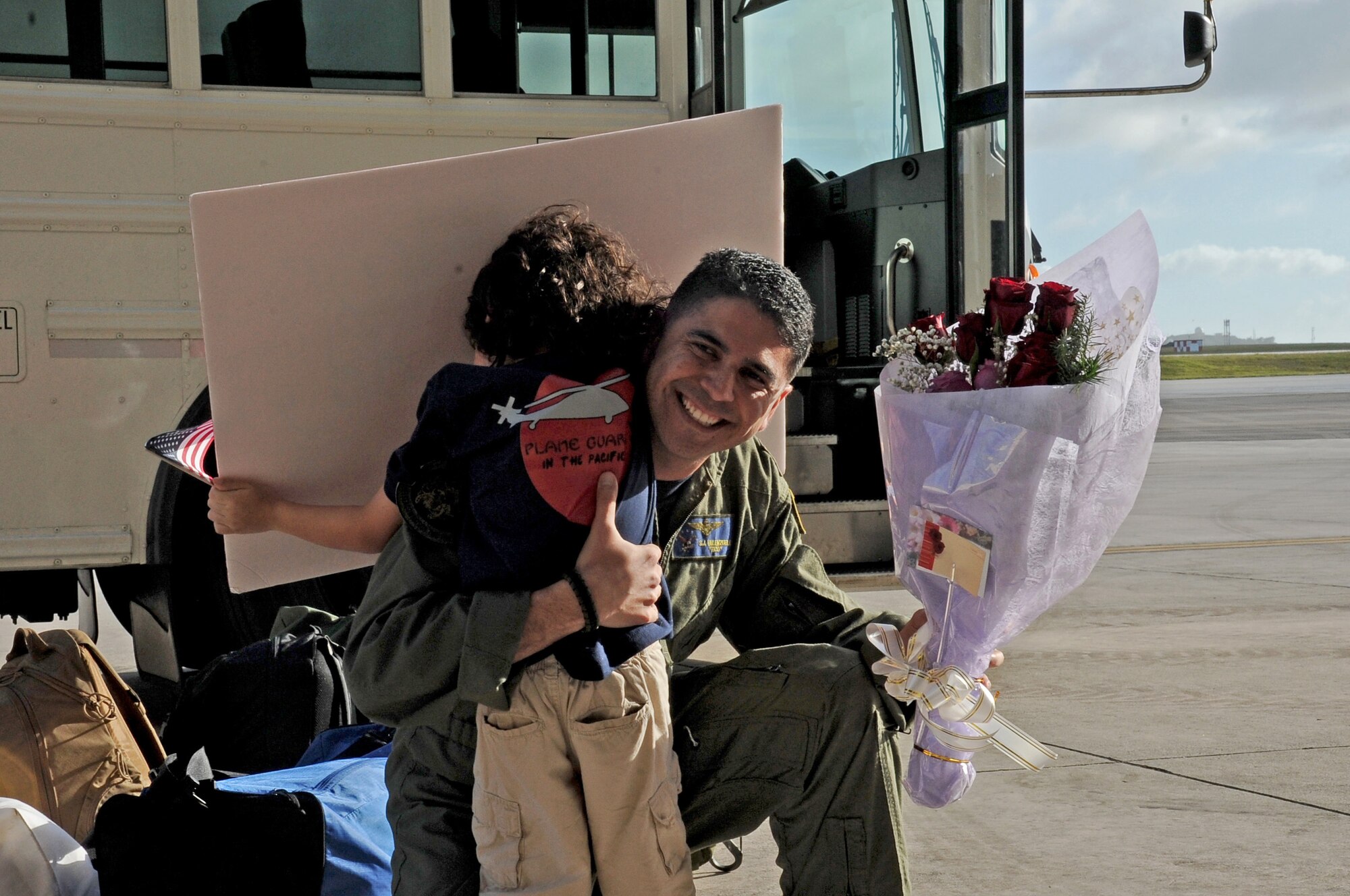 U.S. Navy Lt. Cmdr. Santico Valenzuela, Helicopter Sea Combat Squadron TWO FIVE, Detachment SIX officer in-charge, embraces his son during the detachment’s homecoming at Andersen Air Force Base, Guam, Dec. 17, 2012. The detachment returned from a six-month deployment aboard the USS Bonhomme Richard (LHD 6). The deployment enabled the squadron’s first use of a three-aircraft detachment supporting numerous missions in support of the certification exercises for the 31st Marine Expeditionary Unit, Camp Hansen, Okinawa, Japan, and the Philippine bilateral exercise. (U.S. Air Force photo by Airman 1st Class Adarius Petty/Released)