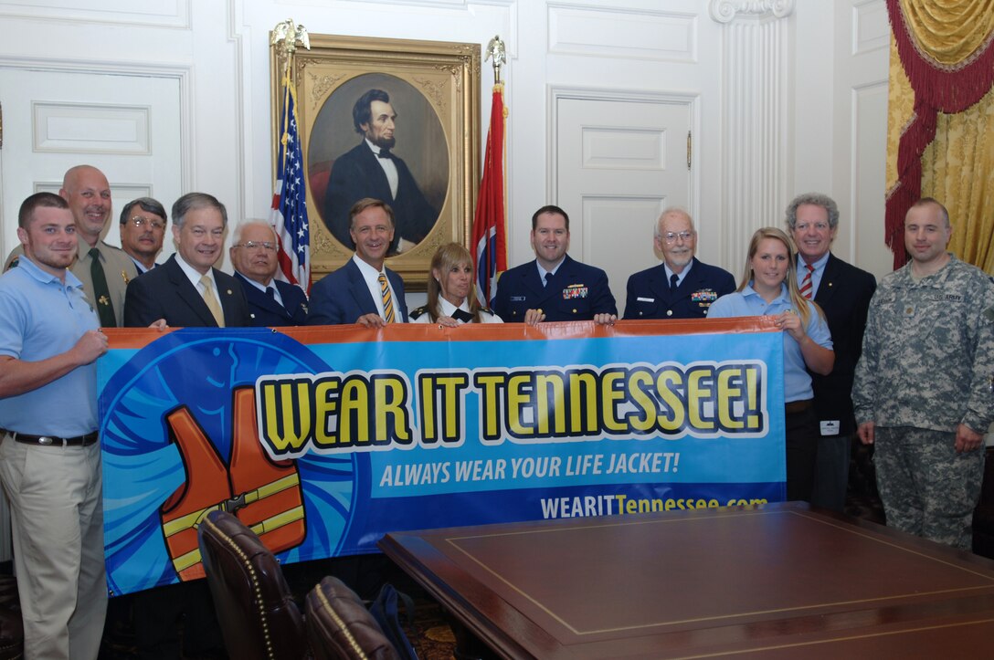 Tennessee Gov. Bill Haslam (Center) poses with a "Wear It Tennessee" sign for a photo at the Tennessee State Capitol at Nashville, Tenn., May 18, 2011. (USACE photo by Lee Roberts)
