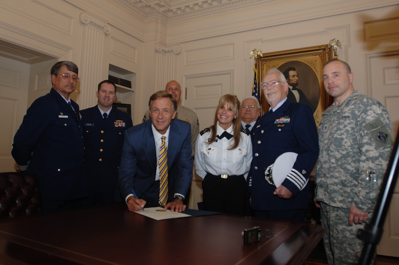 Tennessee Gov. Bill Haslam (Center) poses for a photo at the Tennessee State Capitol at Nashville, Tenn., May 18, 2011 with his proclamation for Safe Boating Week, which is May 21-27, 2011. The proclamation had previously been signed May 4, 2011 by the governor. Army Maj. William Judson (Far right), U.S. Army Corps of Engineers Nashville District deputy district engineer, represented the Corps at the event. Also represented are the U.S. Coast Guard Auxiliary, Music City Power Squadron, and Tennessee Wildlife Resources Agency. (USACE photo by Lee Roberts)
