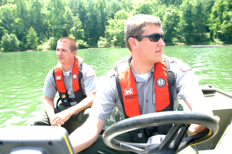 Park Rangers Spencer Taylor (Front) and John Malone, U.S. Army Corps of Engineers Nashville District, take a boat out on Martins Fork Lake in Smith, Ky., May 25, 2011.  Both rangers are participating in a one-year training program that will prepare them for permanent assignments as park rangers in the Nashville District. (USACE photo by Leon Roberts)