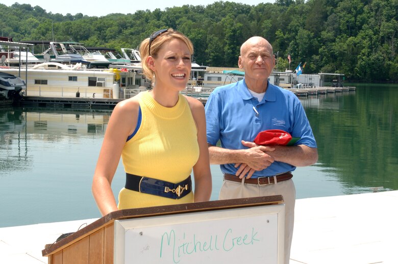 April Smith, president of Mitchell Creek Marina in Allons, Tenn., comments at the end of a "Clean Marina" dedication ceremony June 3, 2011.  Her father and owner of the marina, Doug Smith, stands at her side.  (USACE photo by Lee Roberts)