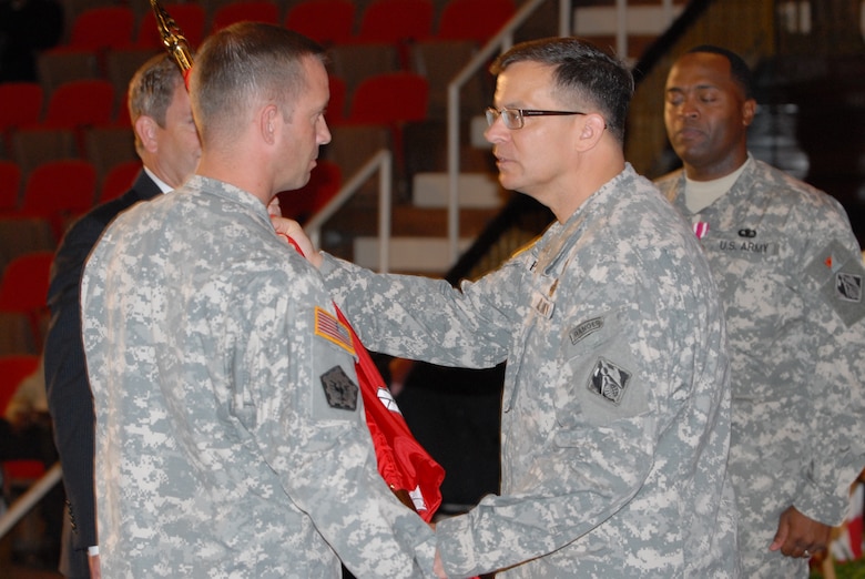Maj. Gen. John W. Peabody, commander of the Great Lakes and Ohio River Division, passes the Nashville District colors to Lt. Col. James A. DeLapp who became the 62nd commander during a ceremony June 24, 2011 at the Grand Masonic Lodge in Nashville, Tenn.(USACE photo by Mark Rankin)