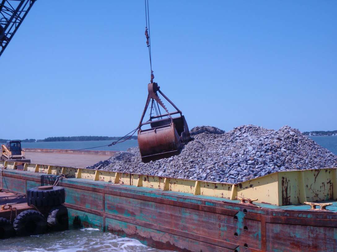 Placing substrate to aid in oyster restoration.        