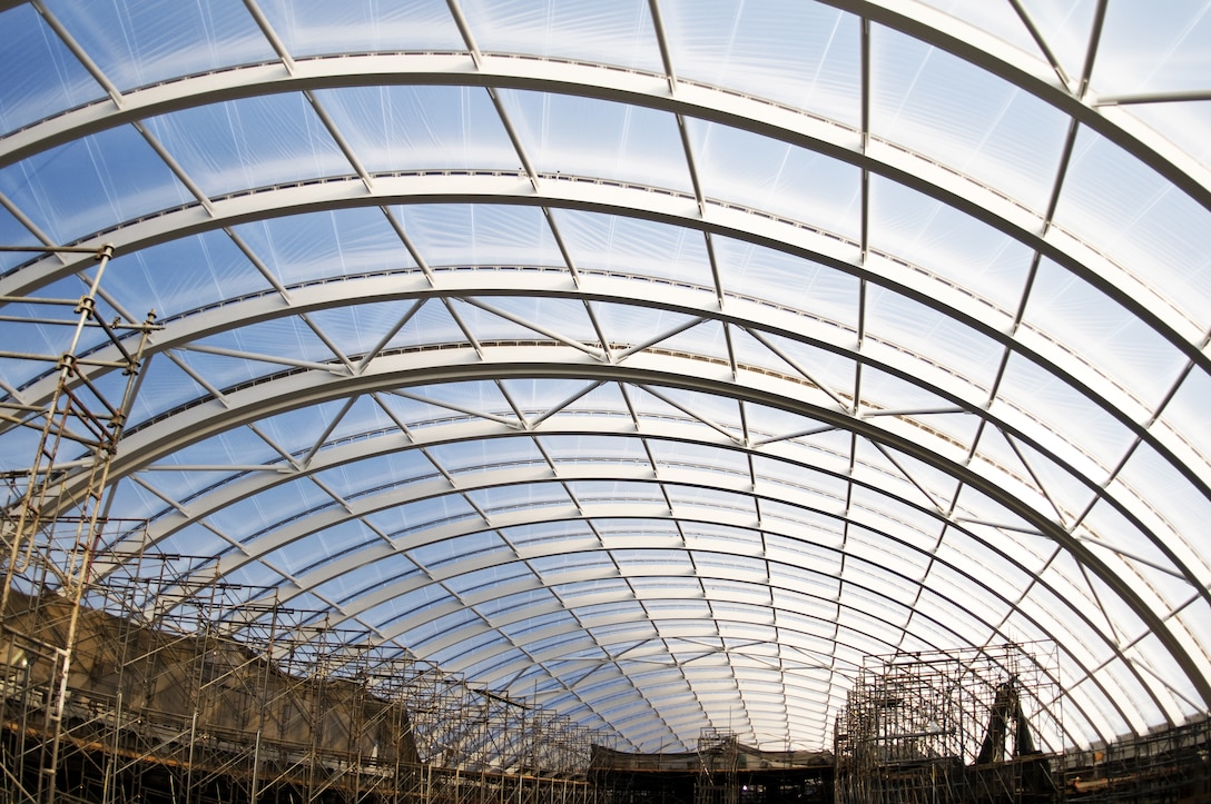 ETFE is a fluorine based plastic designed to protect against corrosion and provide substantial strength over a wide temperature range. The material is 1 percent the weight of glass, and its translucent nature allows natural light into facilities and helps control heat gain, thus reducing amounts of electricity used within the facility. 