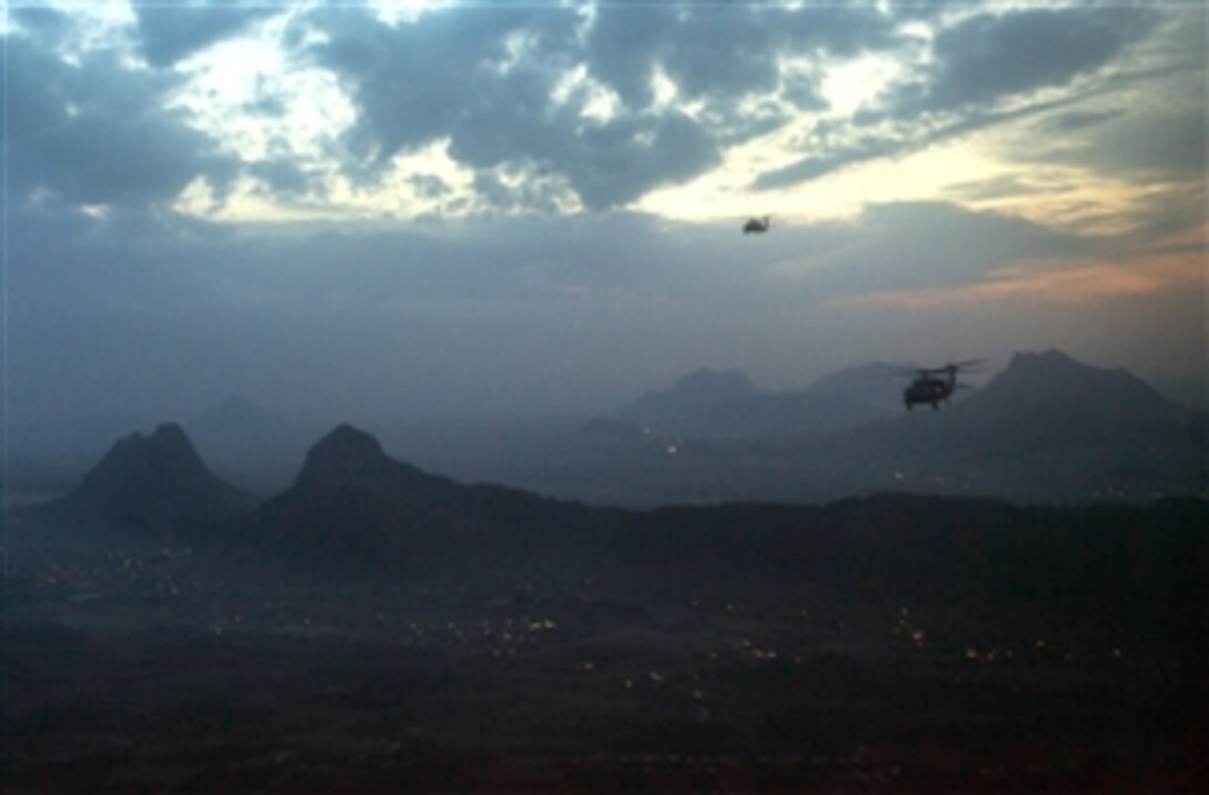 U.S. Army UH-60 Black Hawk helicopters fly over Kandahar, Afghanistan, on Dec. 16, 2012.  