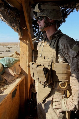 Lance Cpl. Kody Broderick, machine gunner, Weapons Company, 3rd Battalion, 9th Marine Regiment, Regimental Combat Team 7, stands post, Dec. 11, 2012. Broderick, from North Pole, Alaska, is used to harsh winters where temperatures drop to negative 60 degrees Fahrenheit.