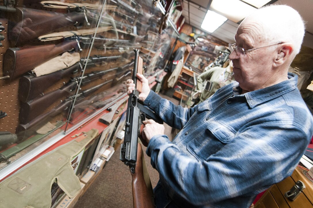 BALTIMORE—Donald Rollette, a retired Reserve Marine, handles his Thompson submachine gun in the basement of his house in Baltimore, Oct. 16, 2012. Rollette purchased his first weapon in 1947 for 50 cents but now he owes more than 50 weapons in his personal museum. Along with other artifacts, his collection is valued upwards of $1 million. (U.S. Marine Corps photo by Cpl. Marcin Platek) 