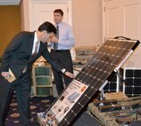 Congressman Eric Cantor, house majority leader (VA-07), examines the Ground Renewable Expeditionary Energy System after being briefed by Clint Govar (right), a Marine Corps Systems Command senior engineer with Expeditionary Power Systems, during a visit to Quantico, Va., earlier this month. 