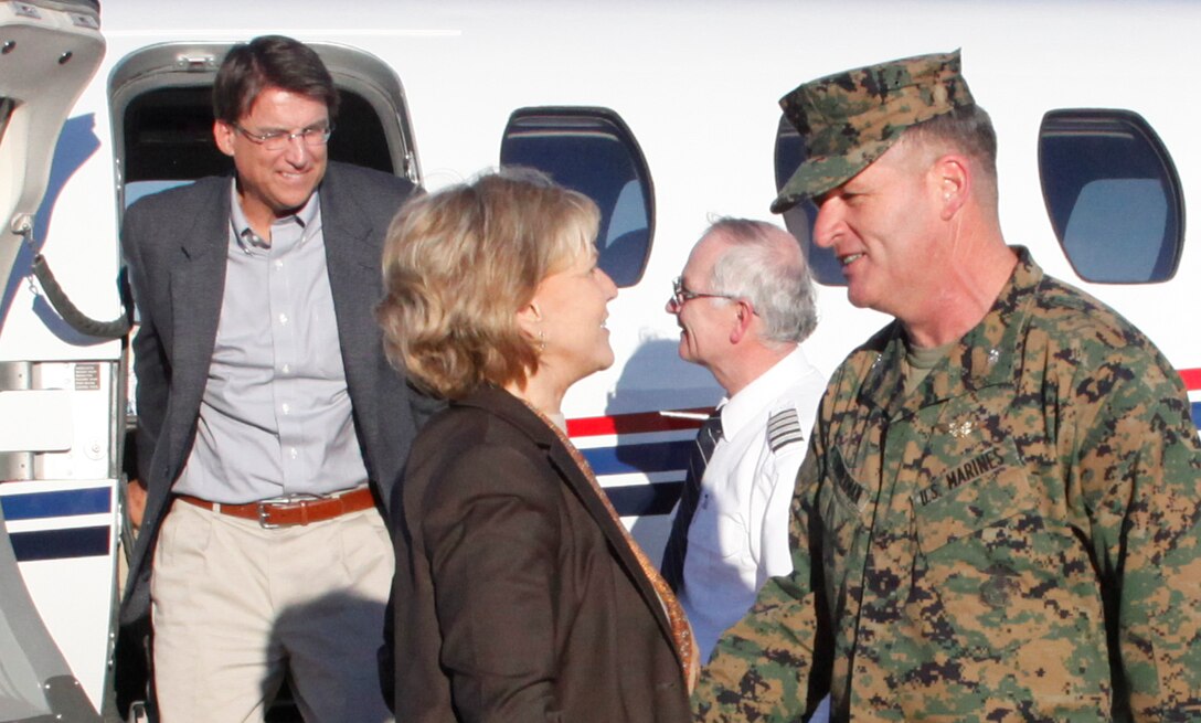 Col. Philip J. Zimmerman, Commanding Officer of Marine Corps Air Station Cherry Point, greets North Carolina Governor Beverly Purdue and Governor-elect Pat Mc Crory as they step on the air station flight line Friday. Cherry Point was one stop of many the governor and governor-elect made as an effort to foster relationships between local military and government officials. 