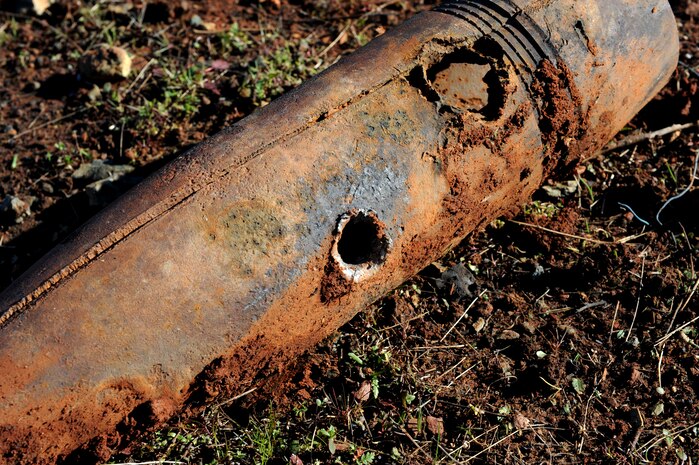 Inert ordnance is damaged by a shaped charge at the explosive ordinance disposal range on Beale Air Force Base, Calif., Dec. 19, 2012. EOD Airmen often train with different explosives to see the blasting effects. (U.S. Air Force photo by Staff Sgt. Robert M. Trujillo/Released)