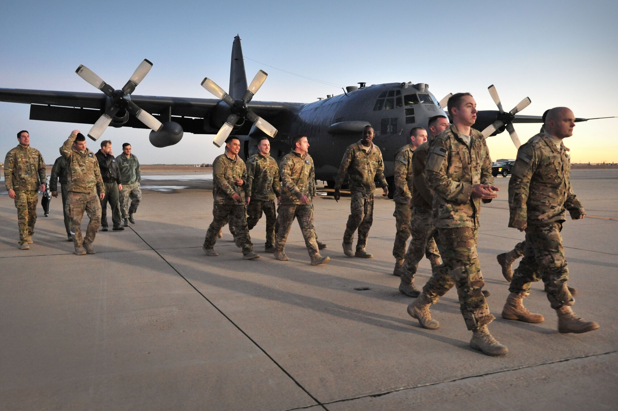 A group of Air Commandos with the 16th Special Operations Squadron are welcomed back home on the flightline at Cannon Air Force Base, N.M., Dec. 20, 2012. The arrival of this gunship marked the first time in more than eight years that the entire fleet has been home stateside. (U.S. Air Force photo/Senior Airman Alexxis Pons Abascal) 