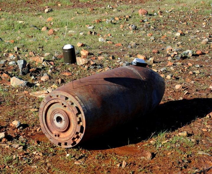 Shaped charge explosives are placed on training aid bombs at the explosive ordinance disposal range on Beale Air Force Base, Calif., Dec. 19, 2012. EOD Airmen train with different types of explosives to simulate what they may encounter in the field. (U.S. Air Force photo by Staff Sgt. Robert M. Trujillo/Released)