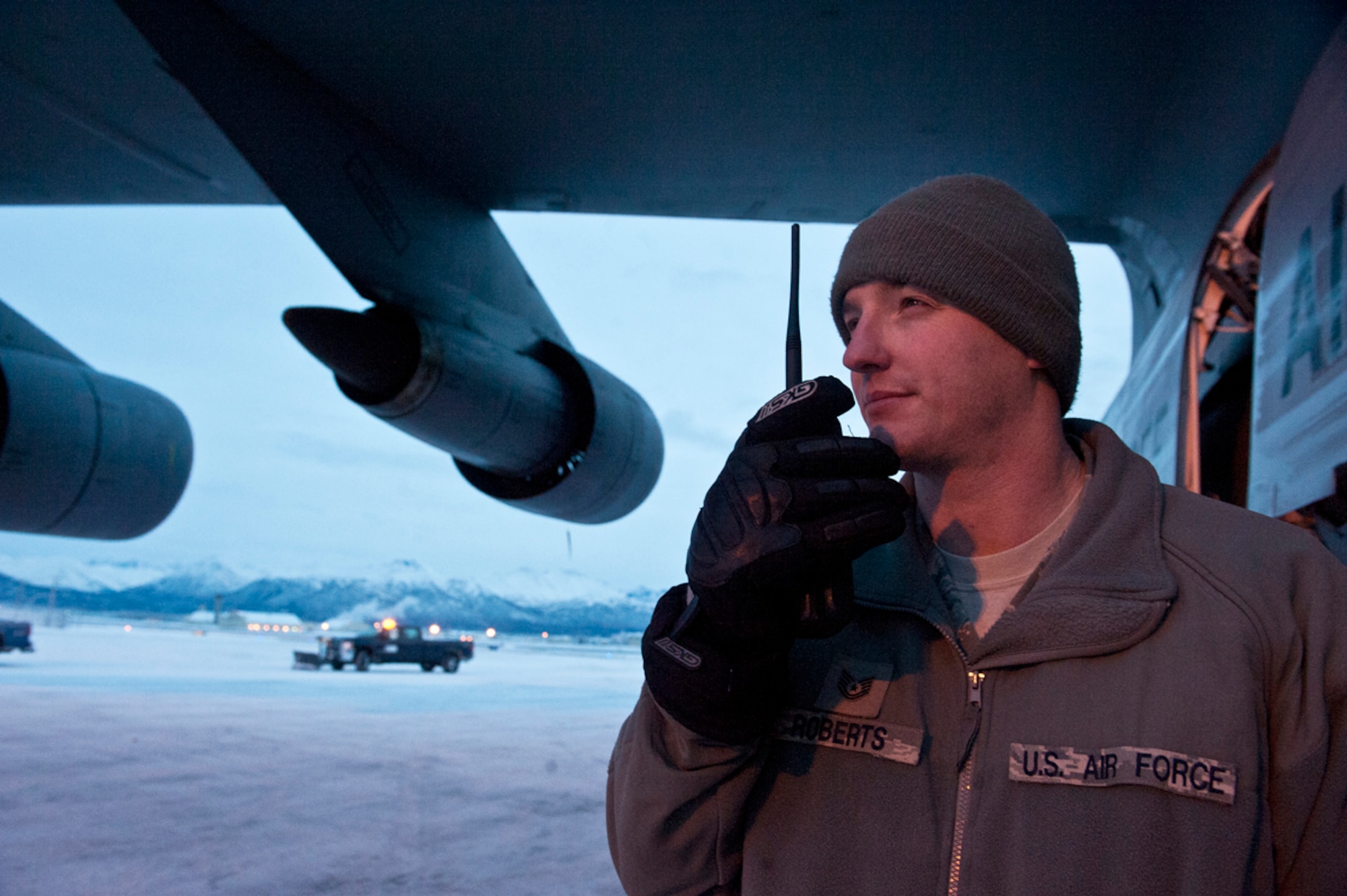 Tech. Sgt. David Roberts radios the Maintenance Operations Center while he works to ensure the safe flight of the installation C-5A Galaxy during its stay on JBER Dec. 18. Roberts is a flight line expeditor for the 732nd Aircraft Maintenance Squadron, one of the many aircraft maintainers that work on more than 150 aircraft including C-17 Globemasters, KC-10 Extenders, L-100, DC-6, and more flying into JBER monthly. His hometown is Folkston, Ga. (U.S. Air Force photo/Staff Sgt. Robert Barnett)