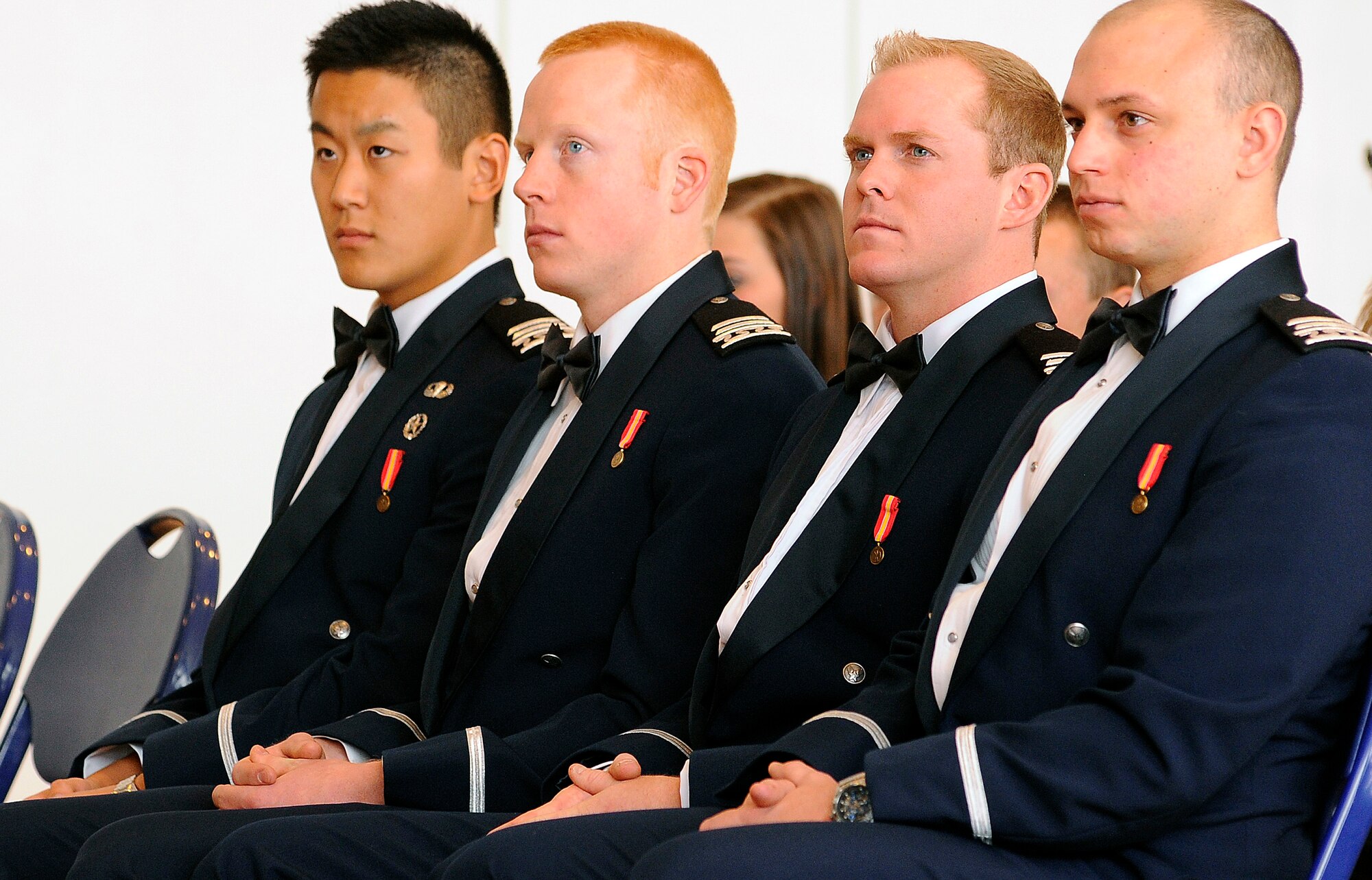From left to right: Cadets 1st Class Jonathan Yi, Erik Soderberg, Connor Dietz and Raymond Crone III receive their diplomas in a winter graduation ceremony held Wednesday in Arnold Hall. Academy Superintendent Lt. Gen. Mike Gould encouraged the newly commissioned officers to strive to be leaders of vision and character. (U.S. Air Force photo/Mike Kaplan)