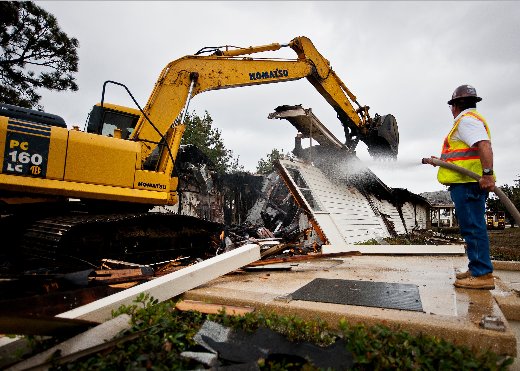 Jobe Everson, tears down Bldg. 666 with an excavator Dec. 20 at Eglin Air Force Base, Fla.  The old building was used by the 96th Civil Engineer Group for many years.  The entire demolition and clean up is supposed to take approximately two weeks depending on weather.  (U.S. Air Force photo/Samuel King Jr.)