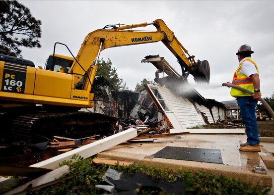 Jobe Everson, tears down Bldg. 666 with an excavator Dec. 20 at Eglin Air Force Base, Fla.  The old building was used by the 96th Civil Engineer Group for many years.  The entire demolition and clean up is supposed to take approximately two weeks depending on weather.  (U.S. Air Force photo/Samuel King Jr.)