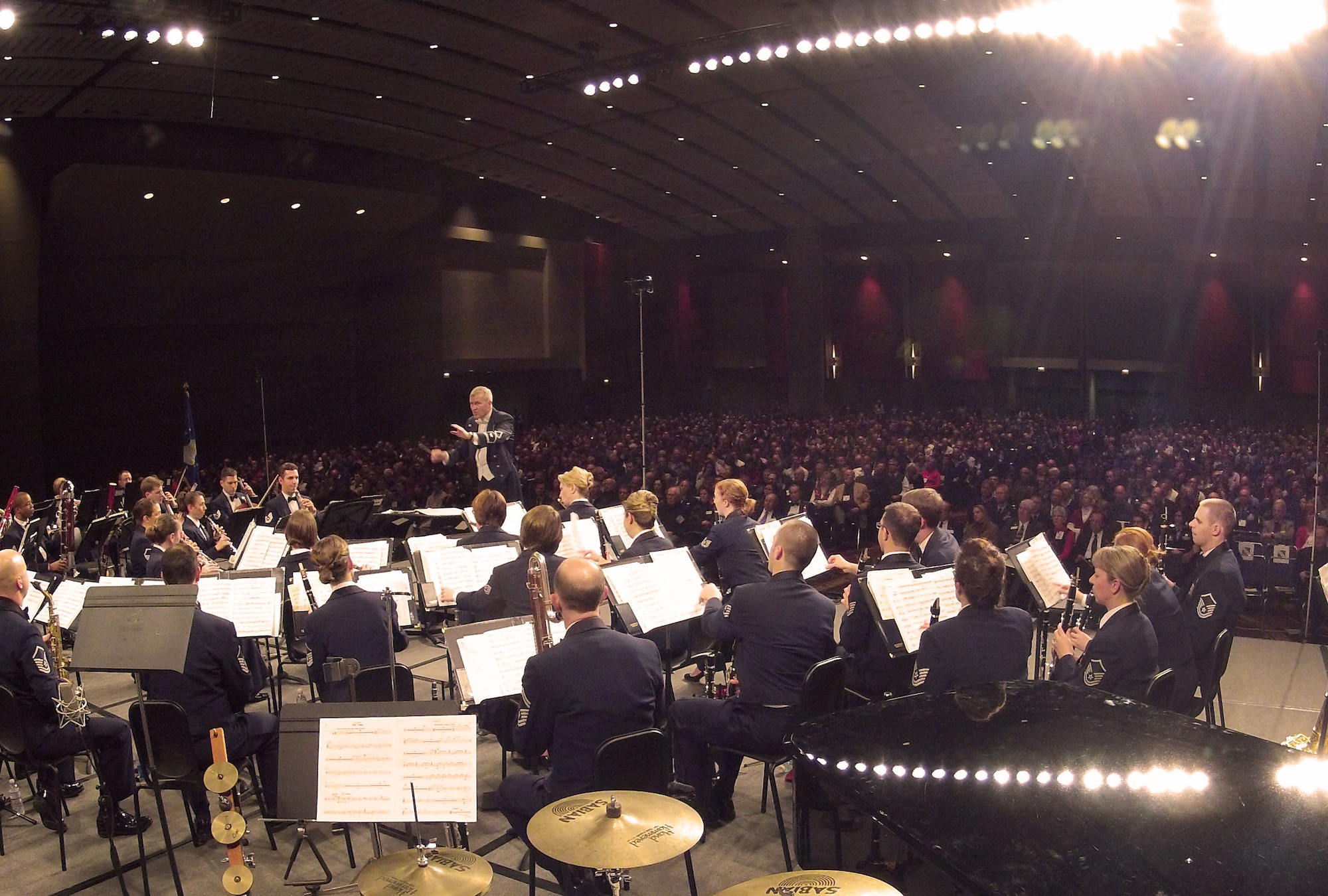 U.S. Air Force Premier Concert Band Conductor Col. Larry Lang showcases the talents of Airmen musicians for thousands in attendance during the 66th Annual Midwest Clinic, Dec. 19, in Chicago, Ill. Every military band sets to exemplify the professionalism that is existent throughout everything in each one's branch of service. The non-verbal message that is communicated by the USAF Band's music is that every single task Airmen perform, across the globe, are done at this professional level. (U.S. Air Force photo by Senior Airman Steele C. G. Britton)