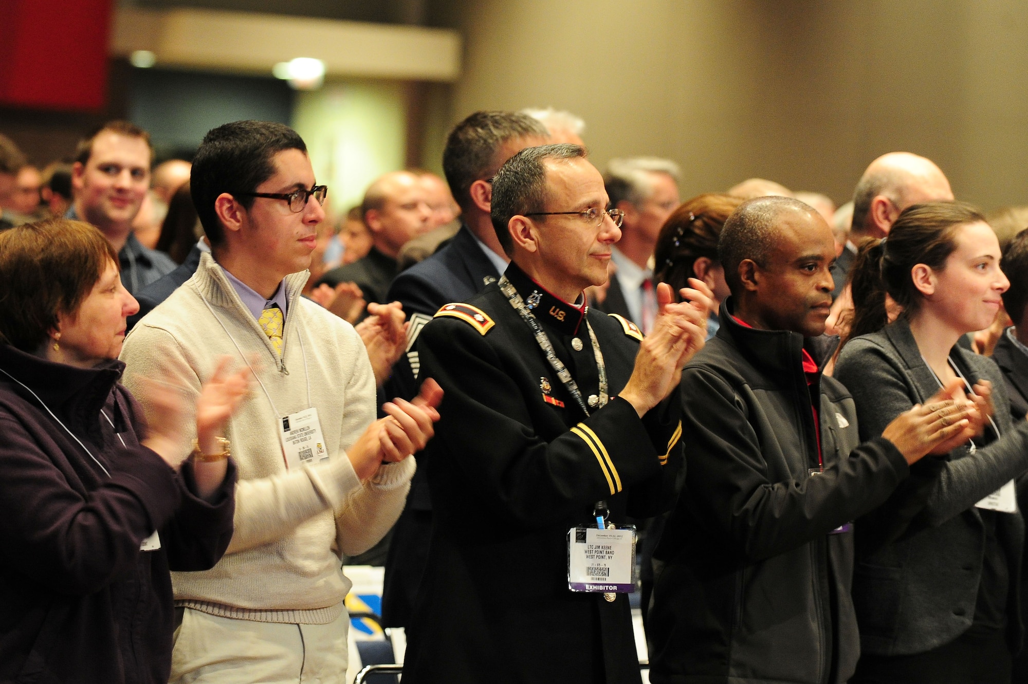 Musicians, family, friends, mentors and fans of the U.S. Air Force Premier Band give a standing ovation following the third and final performance by the band at the 66th Annual Midwest Clinic, Dec. 19, in Chicago, Ill. "This is one of the most amazing bands in the United States and in the world," said Christopher Poncin, high school band director in the state of Washington. "They set the bar higher and higher every time I see them perform. We are fortunate and blessed here, at the Midwest Clinic, to see and experience an ensemble with such great conductors." (U.S. Air Force photo by Senior Airman Steele C. G. Britton)