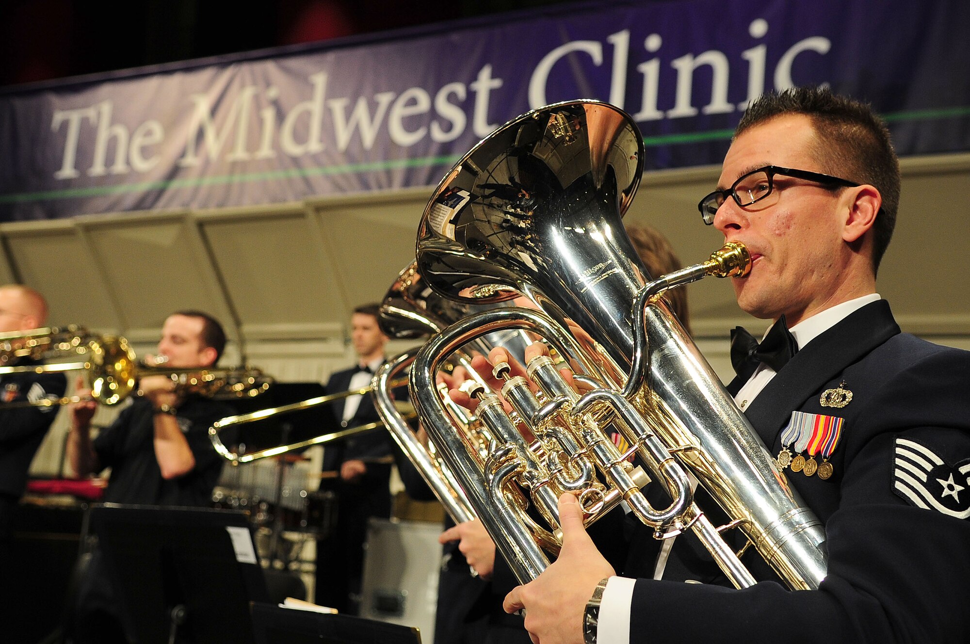 Tech. Sgt. Joseph Bello, U.S. Air Force Band euphonium player, performs alongside fellow Airmen musicians at the 66th Annual Midwest Clinic, Dec. 19, in Chicago, Ill. Every six years the USAF Band has the opportunity to perform at the clinic as they rotate the experience with fellow premier bands from each military branch stationed in Washington, D.C. (U.S. Air Force photo by Senior Airman Steele C. G. Britton)