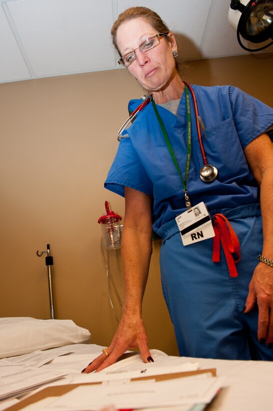 Leah Walker, Rapid City Regional Hospital sexual assault nurse examiner, examines a sexual assault medical kit at the RCRH in Rapid City, S.D., Dec. 11, 2012. Walker is one of nine SANEs in the hospital that, once certified, can complete the entire process of a sexual assault procedure without a doctor present except for X-rays, CT scans and prescriptions. (U.S. Air Force photo by Airman 1st Class Kate Thornton-Maurer/Released)