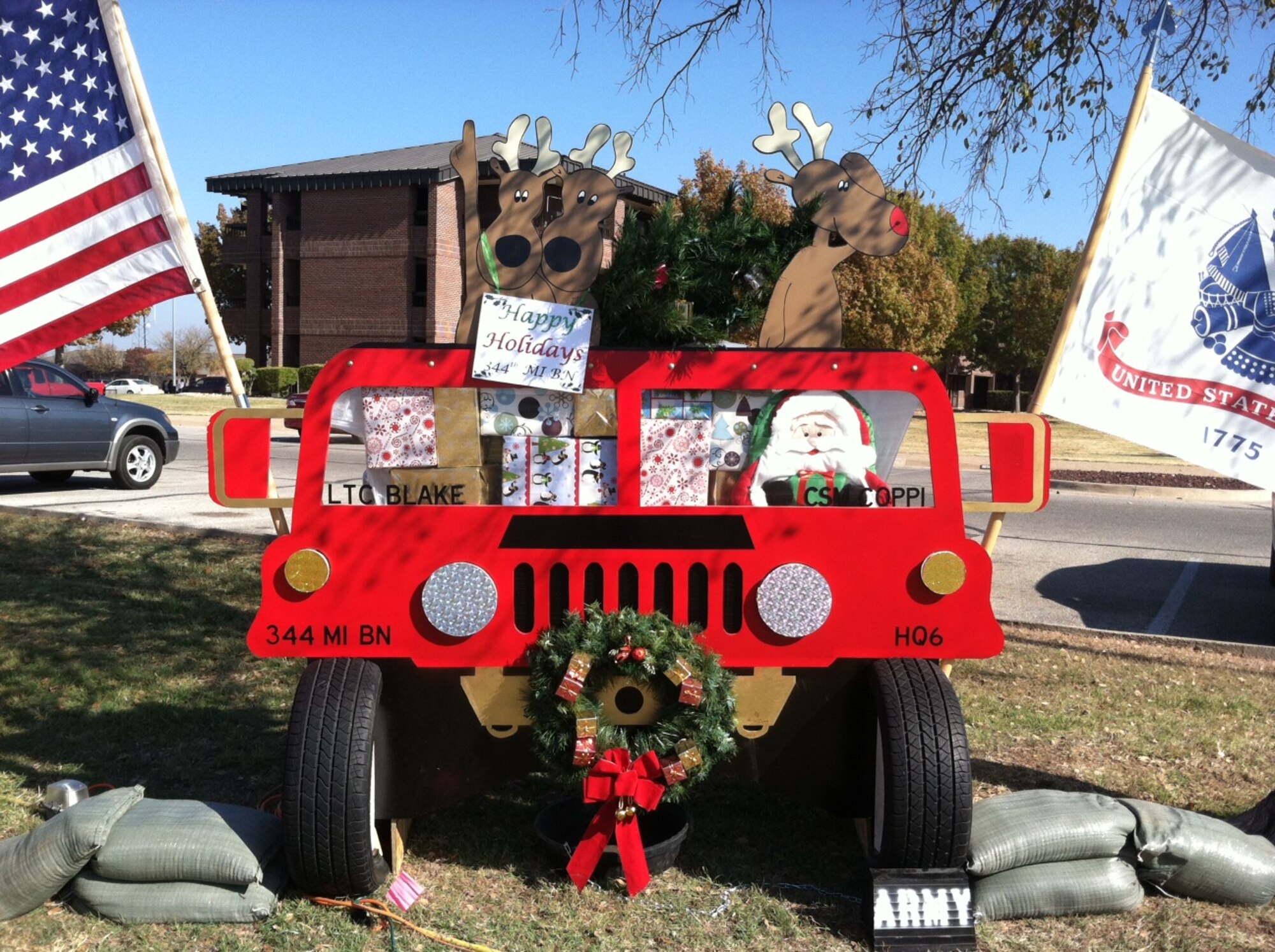 GOODFELLOW AIR FORCE BASE, Texas – The Army 344th Military Intelligence Battalion won first place in the Annual Holiday Card competition here Dec. 7th. The Army 344th MIB designed their card to look like a Humvee with Santa Claus driving it. The card was also designed to look like it had presents in the passenger seat and reindeer in the back. The Marine Corps Detachment finished second, the Angelo Inn placed third and the 17th Security Forces Squadron earned honorable mention. (Courtesy photo)