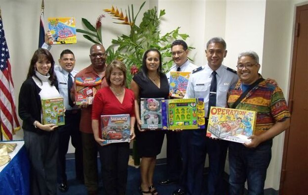 Past and present members of the 44th Aerial Port Squadron and the 624th Aerospace Medicine Squadron participated in their 3rd annual "RUN-4-TOYS" event dedicated to improving the lives and spirits of the patients at the Guam Memorial Hospital’s Pediatric Ward, Dec.12, 2012.  From left - Lisa Nangauta, Chief Master Sgt. Maurice Sayama, Senior Master Sgt. Michael Williams-ret., Senior Master Sgt. Edith Mesa-ret., Sharmain Shoda, event co-ordinator, Maj. Anthony San Niccolas, 44th APS commander, and Master Sgt. Ramon Peredo-ret. (Courtesy photo)