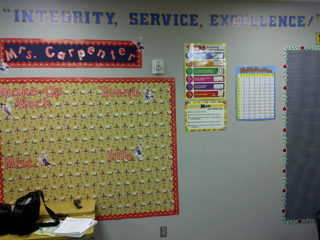 "Integrity, Service, Excellence," remind students of what their teacher, Senior Airman Erin Carpenter, expects of them every day. Carpenter is a Reservist at Peterson Air Force Base, Colo. (Courtesy photo/AimHighErin.com)