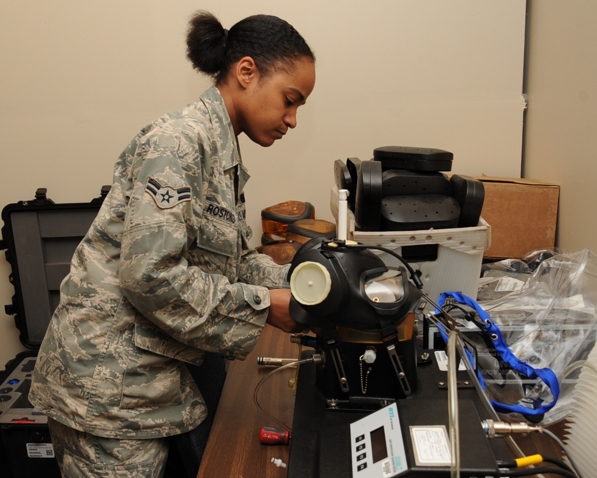Airman 1st Class Burgundy Rostchild, 2nd Logistics Readiness Squadron material management journeyman, tests an M-50 gas mask on Barksdale Air Force Base, La., Dec. 20. The test is done to ensure the mask is serviceable. (U.S. Air Force photo/Senior Airman Sean Martin)