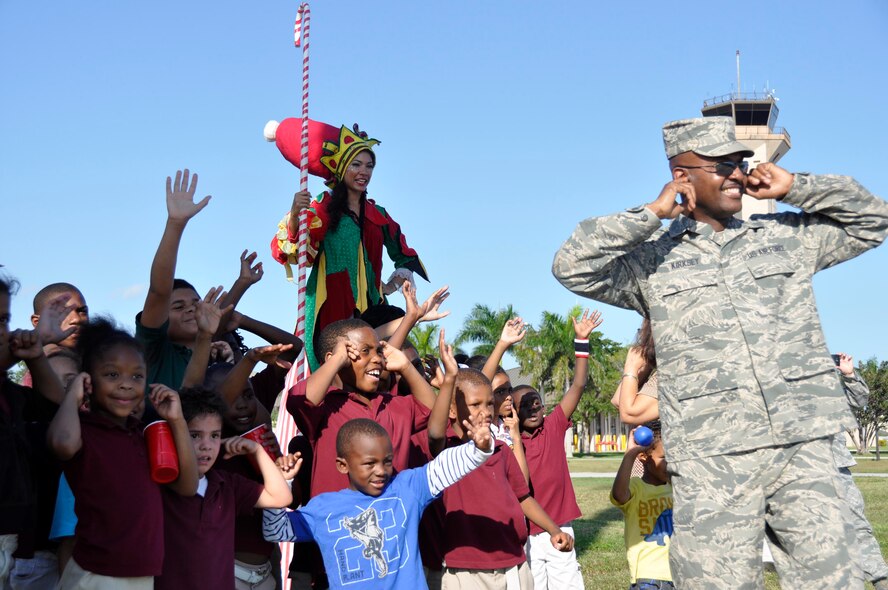 Santa Claus taxis down the flightline in an F-16 to greet children involved with Chapman Partnership at Homestead Air Reserve Base, Fla., Dec. 19. Chapman Partnership, a local organization helping to combat homelessness, provides comprehensive services to empower homeless residents to become self-sufficient. Homestead ARB has also participated with Chapman Partnership on other events such as food drives. (U.S. Air Force photo/Senior Airman Jacob Jimenez)
