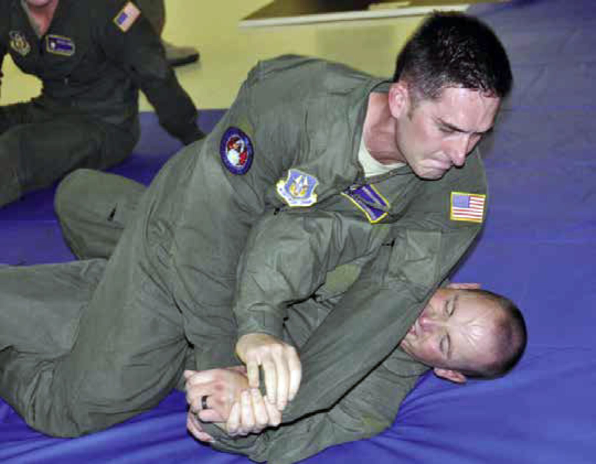 Shown are members of the elite Phoenix Ravens, assigned to March Field, participating in hand-to-hand combat as part of their quarterly training, Nov. 30. They
are taught different fighting positions and ways to maneuver their bodies in order to gain control over an adversary in a hand-to-hand battle. Raven quarterly training involves a series of grueling physical fitness sessions, weapons training and hand-to-hand combat. (U.S. Air Force photo by Megan Crusher)