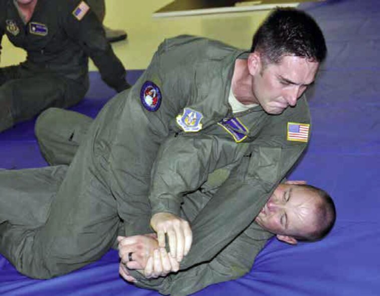 Shown are members of the elite Phoenix Ravens, assigned to March Field, participating in hand-to-hand combat as part of their quarterly training, Nov. 30. They
are taught different fighting positions and ways to maneuver their bodies in order to gain control over an adversary in a hand-to-hand battle. Raven quarterly training involves a series of grueling physical fitness sessions, weapons training and hand-to-hand combat. (U.S. Air Force photo by Megan Crusher)