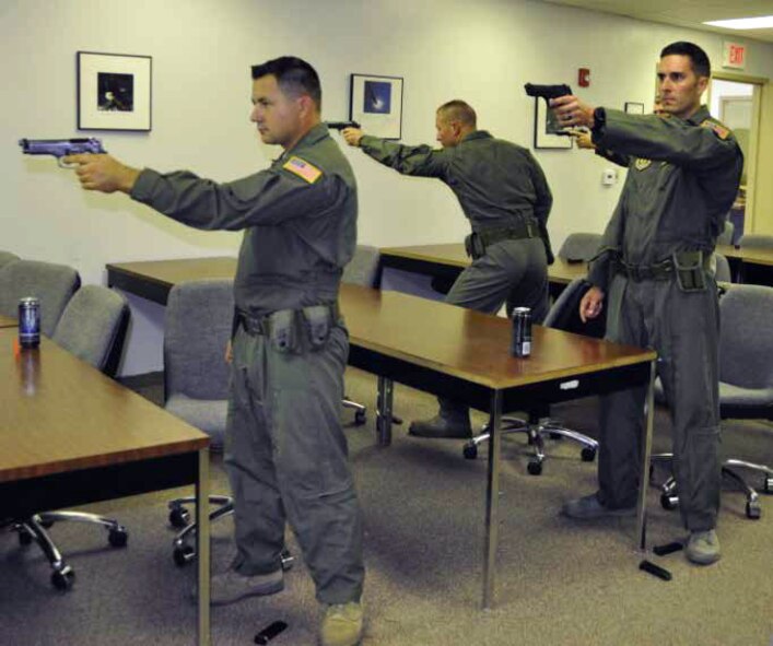 Members of March’s elite Phoenix Ravens attend Practical Pistol Course for Concealed Carry training, Nov. 30. Ravens must qualify like everyone else on the 9mm handgun; however, they must shoot and reload without using their dominant arm. Some stateside missions require that Ravens carry concealed weapons, while most overseas missions forbid the concealment of weapons. (U.S. Air Force photo by Megan Crusher)