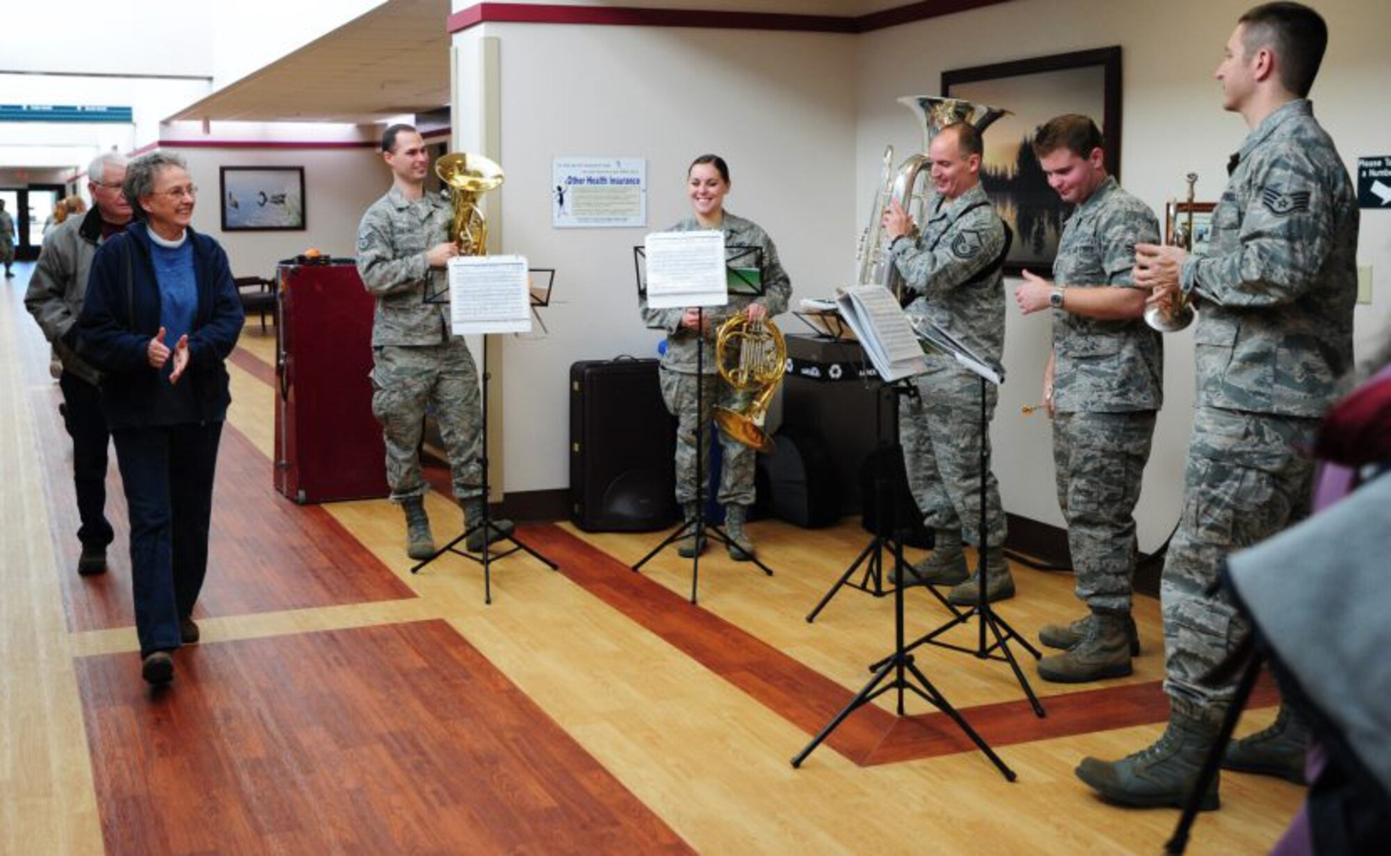 Members of the brass quintet from the Heartland of America Band at Offutt Air Force Base, Neb., perform for 22nd Medical Group customers Dec. 18, 2012.  The band performed at more than 10 locations at McConnell Dec. 18 and 19, McConnell Air Force Base, Kan.  The Heartland of America Band is an Air Force squadron of professional musicians whose backgrounds include advanced degrees in music performance and whose broad mastery of musical styles range from classic to contemporary, jazz to country, and pop to rock.  (U.S. Air Force photo/Staff Sgt. Abigail Klein)