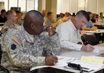 Transition Unit Soldier Maj.
Lonnie Britton listens to instructions
on how to fill out the Individual Transition Plan that is part of the new Transition Assistance Program, or TAP, July 23 at Fort Sill, Okla. Soldiers participated in the six-day long pilot program that launched the newly revised TAP program, which covers finances, job searches, resume preparation and more. Soldiers are now required to begin their preseparation counseling at least 12 months prior to the end of their military terms of service.
Photo by Ben Sherman