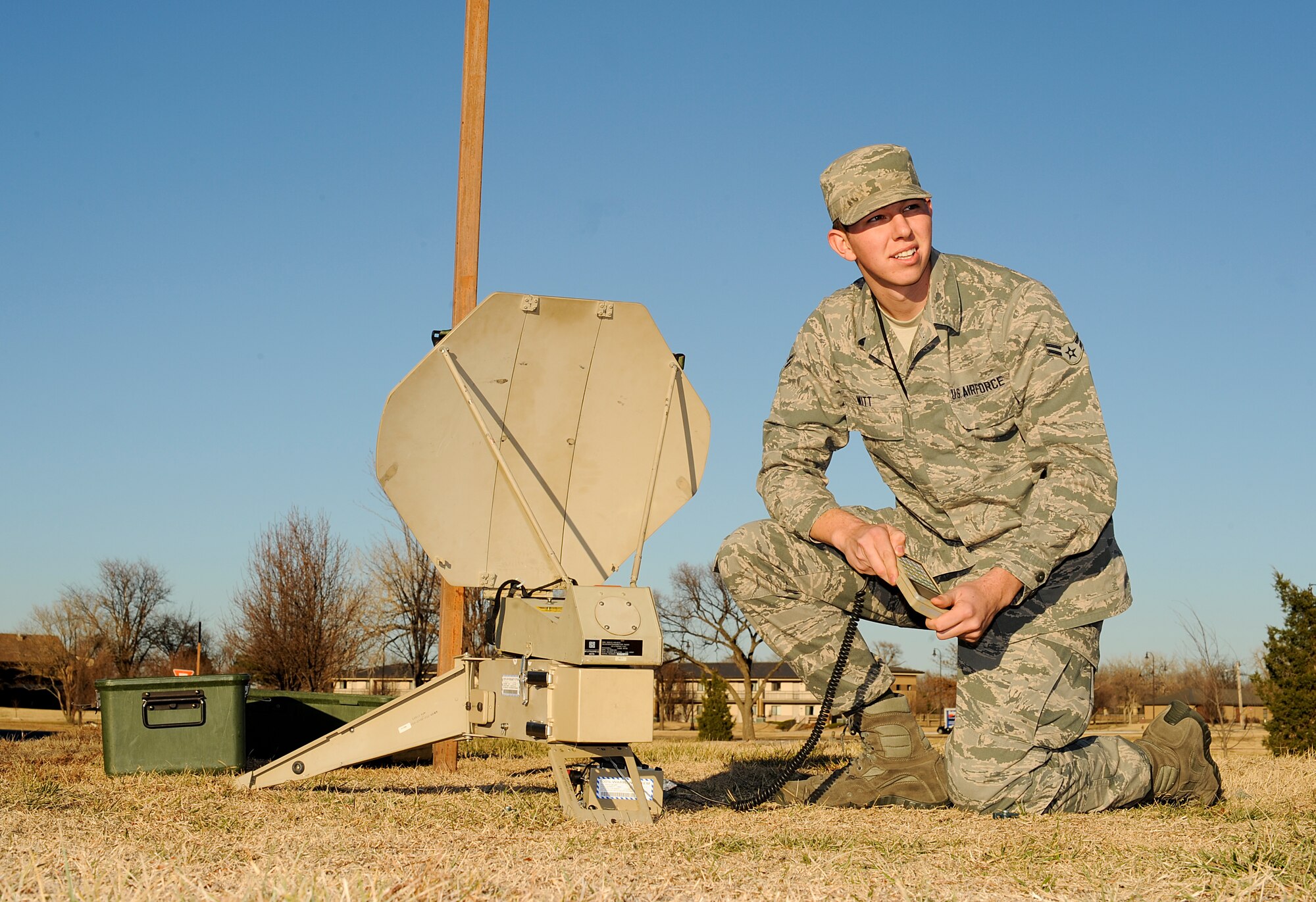 Airman 1st Class Wyatt Witt, 22nd Air Refueling Wing command post controller, sets up a message transmitter and receiver Dec. 17, 2012, McConnell Air Force Base, Kan. Witt was selected as the spotlight performer for the week of Dec. 17 to 21, 2012, for his dedication to the 22nd ARW commander’s intents. (U.S. Air Force photo/Airman 1st Class Jose L. Leon)