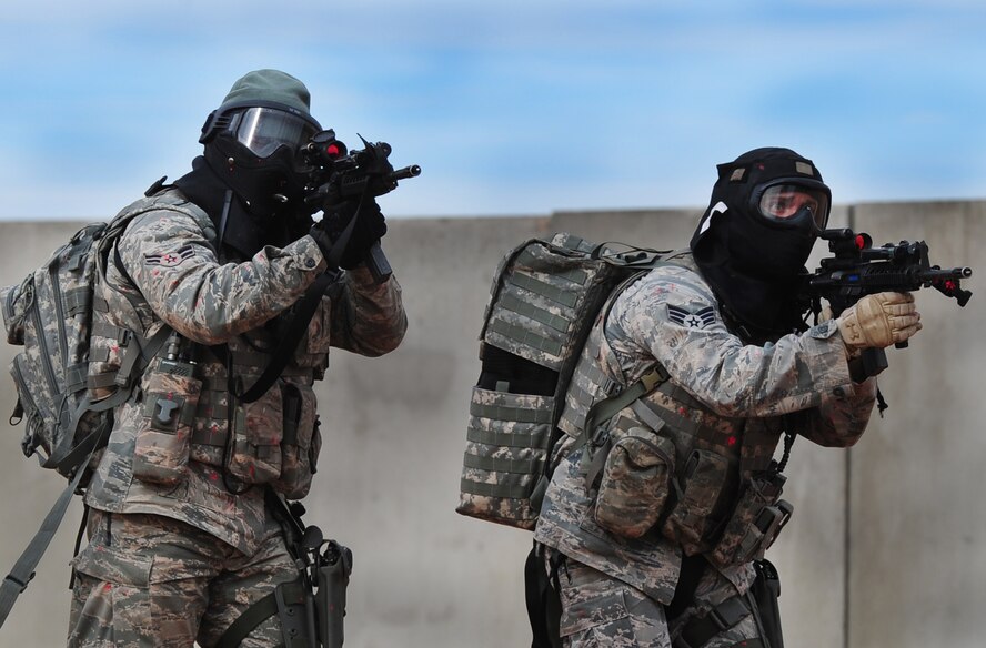 Members of the 27th Special Operations Security Forces Squadron simulate combat against Opposition Forces at Melrose Air Force Range, N.M., Dec. 18, 2012.  This training gave the Air Commandos a chance to gain Special Operations Forces Fly Away Security Team certification.  (U.S. Air Force photo/Airman 1st Class Ericka Engblom)